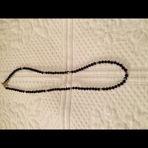 Gold and black necklace